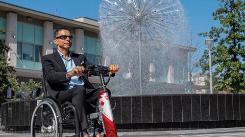 Man in Companion Wheelchair