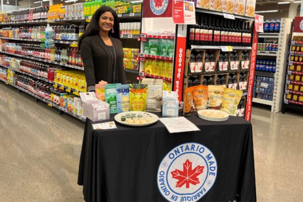 A lady in front of snacks in a store