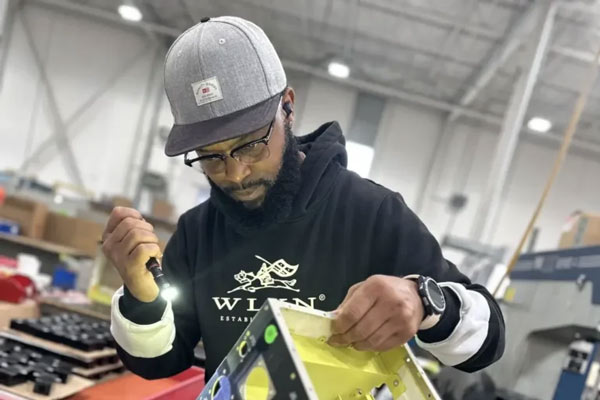 Ben Machine employee looking at a product